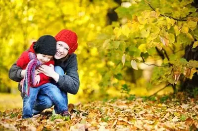 Mother and child playing in the fall in the Smoky Mountains