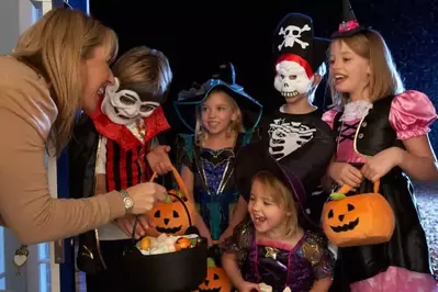 Kids dressed up for halloween on trick-or-treat