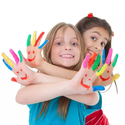Children with painted fingers for arts and crafts