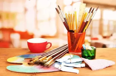 Pencils, brushes, and watercolor for arts and crafts