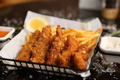 chicken tenders and fries with dipping sauce