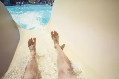 riding down water slide