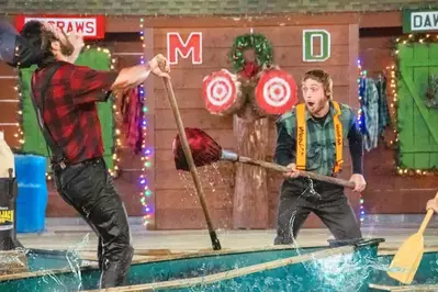 lumberjacks competing at Paula Deen's Lumberjack Feud Christmas show in Pigeon Forge