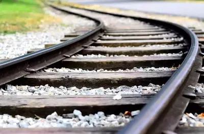 old railroad tracks over gravel