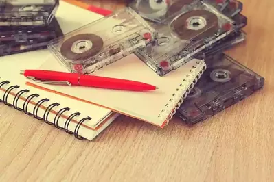 cassete tapes sitting on a notebook