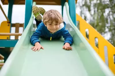 kid on slide at ober gatlinburg