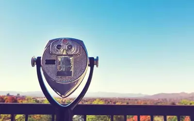 A viewfinder overlooking fall colors in the mountains.