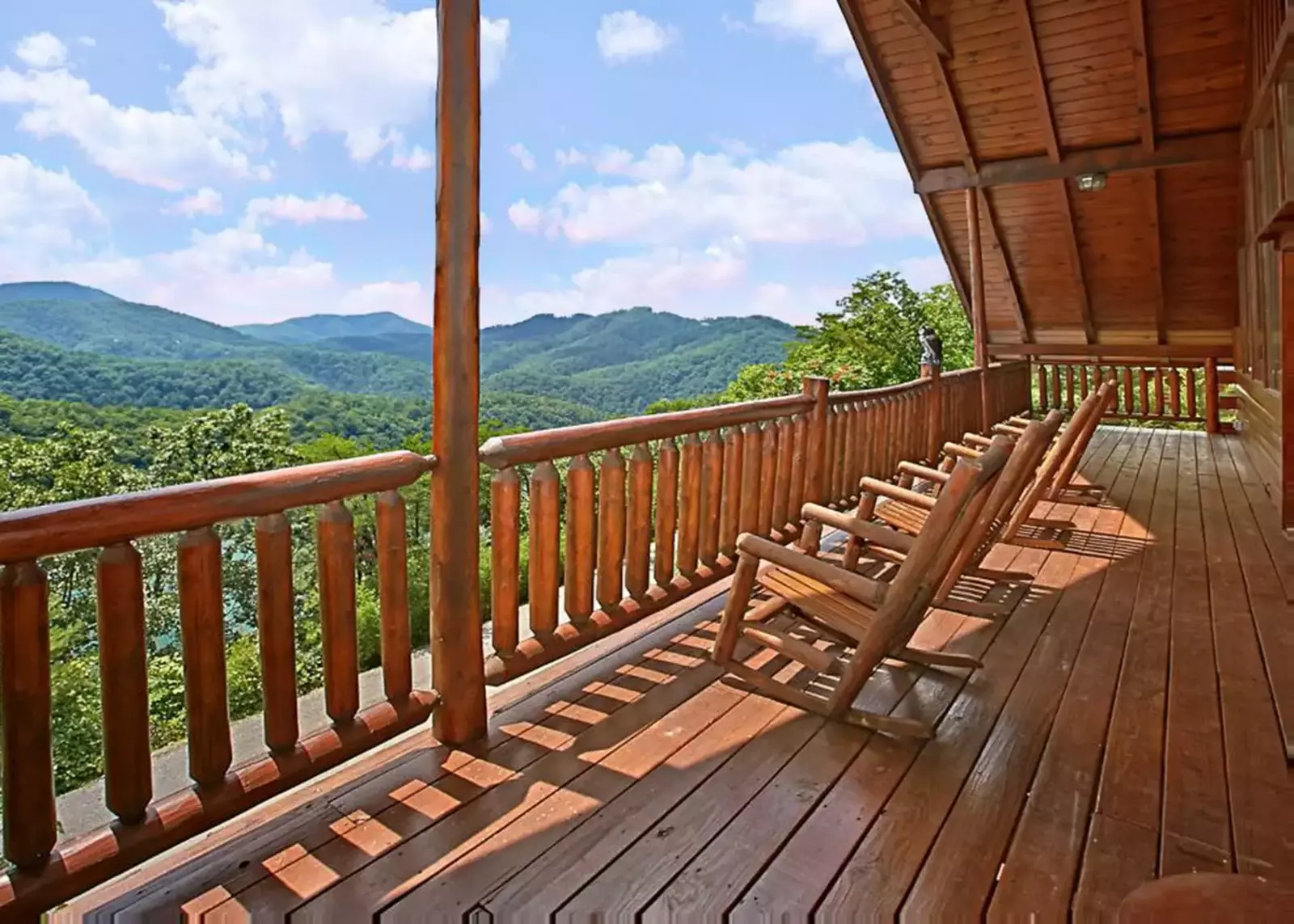  Rocking chairs and a porch swing complete the experience on our covered back deck. 
