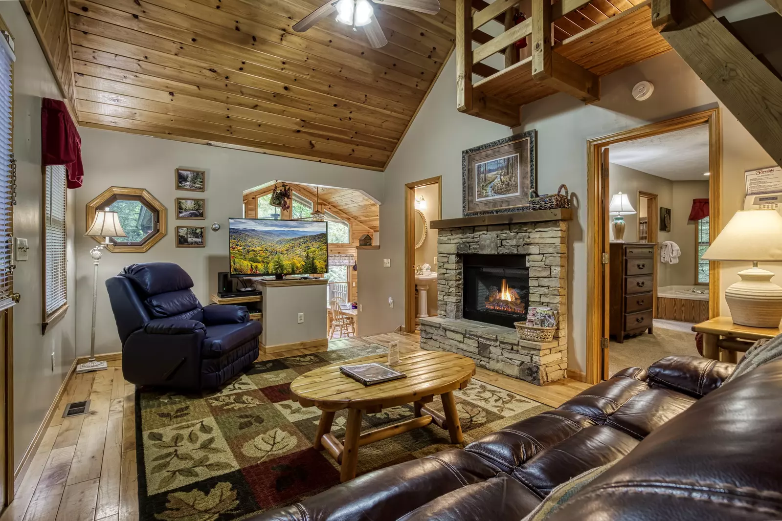 Allen Hideaway living room with stone encased fireplace