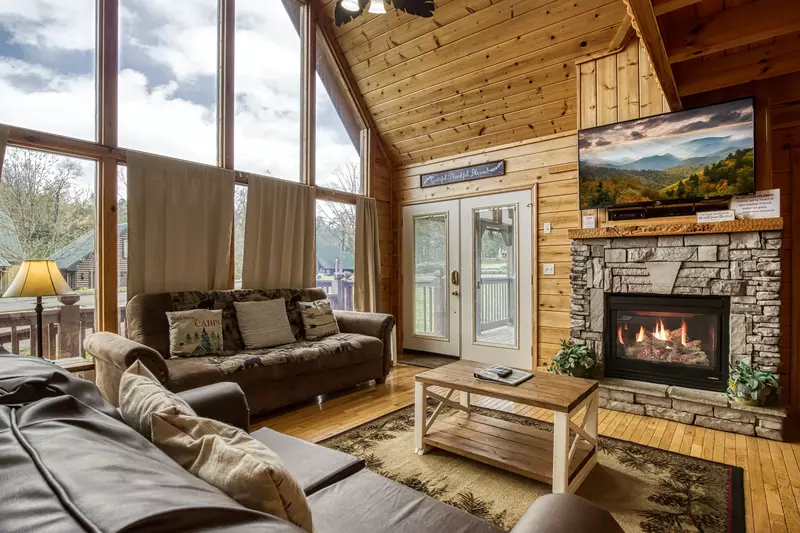 Amazing Grace living room with floor ceiling windows