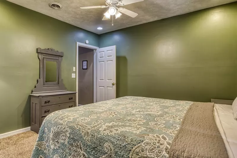 Amazing Grace lower level bedroom with king size bed