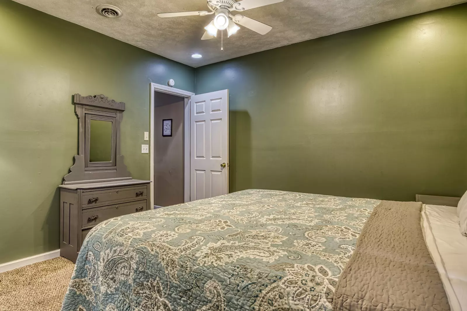 Amazing Grace lower level bedroom with king size bed