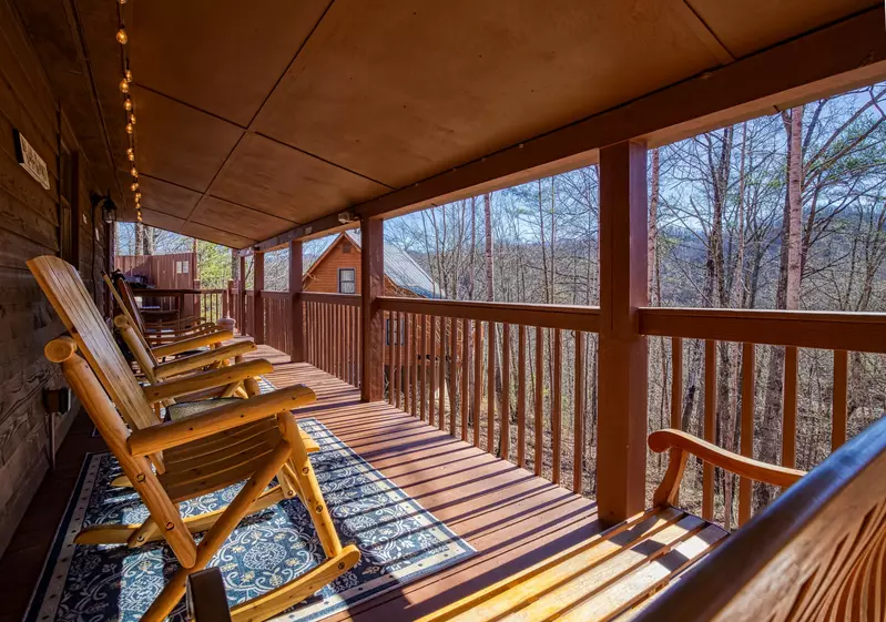 Autumn Colors covered back deck with rocking chairs