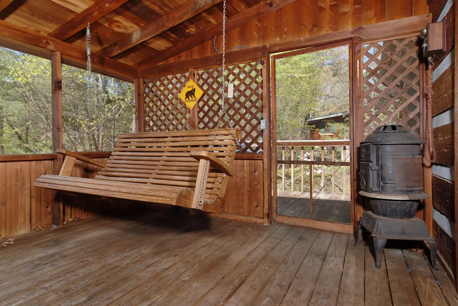 Back to Nature screened in back deck with swing