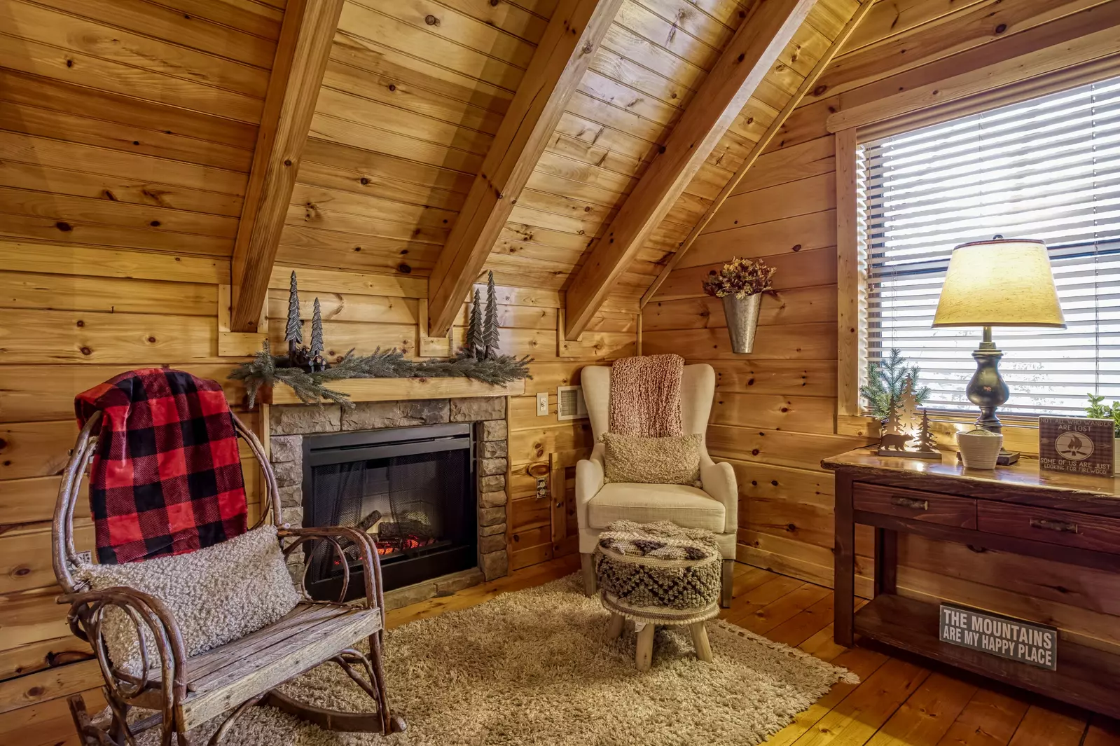 Bearfoots Cozy Cabin upper level bedroom with seasonal gas fireplace