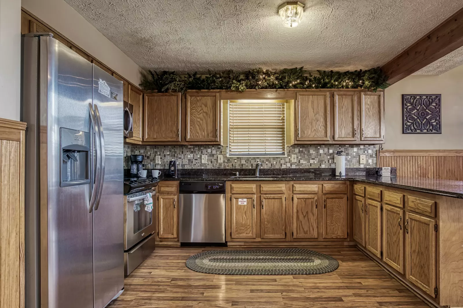 Builtmore Hideaway fully furnished kitchen with stainless steel appliances
