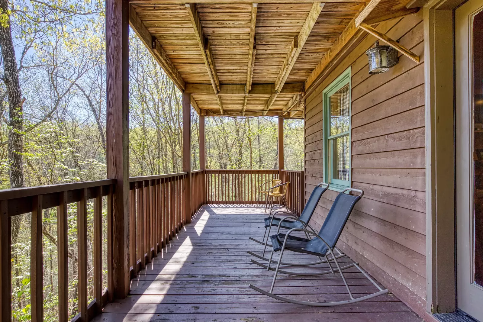 Emerald Forest - Covered lower level deck with rocking chairs