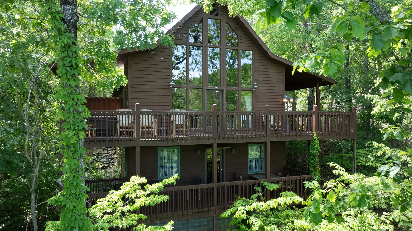 Secluded Summit wrap around main level deck and lower level covered deck