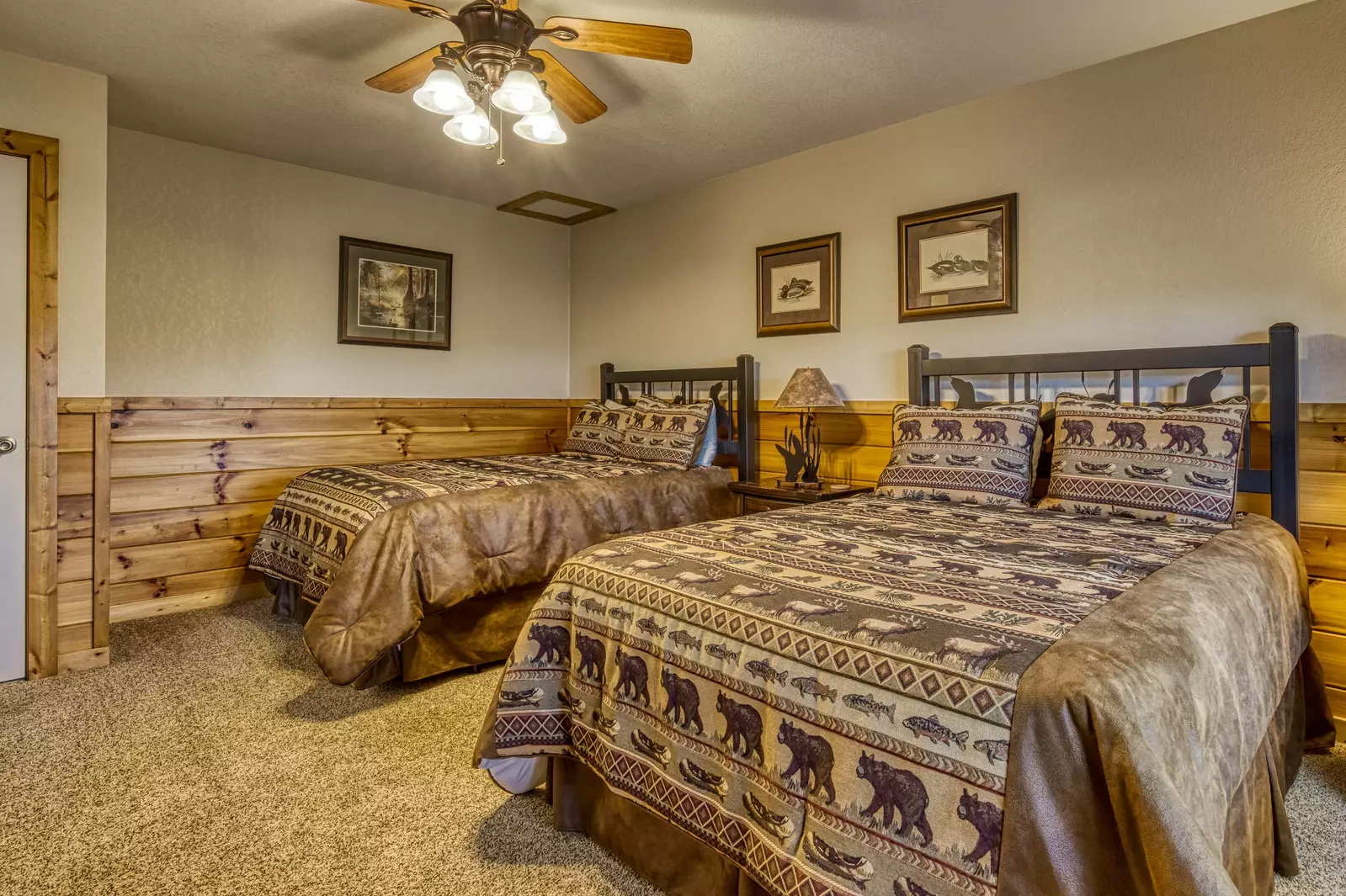 Getaway Mountain Lodge lower level bedroom one with two queen size beds
