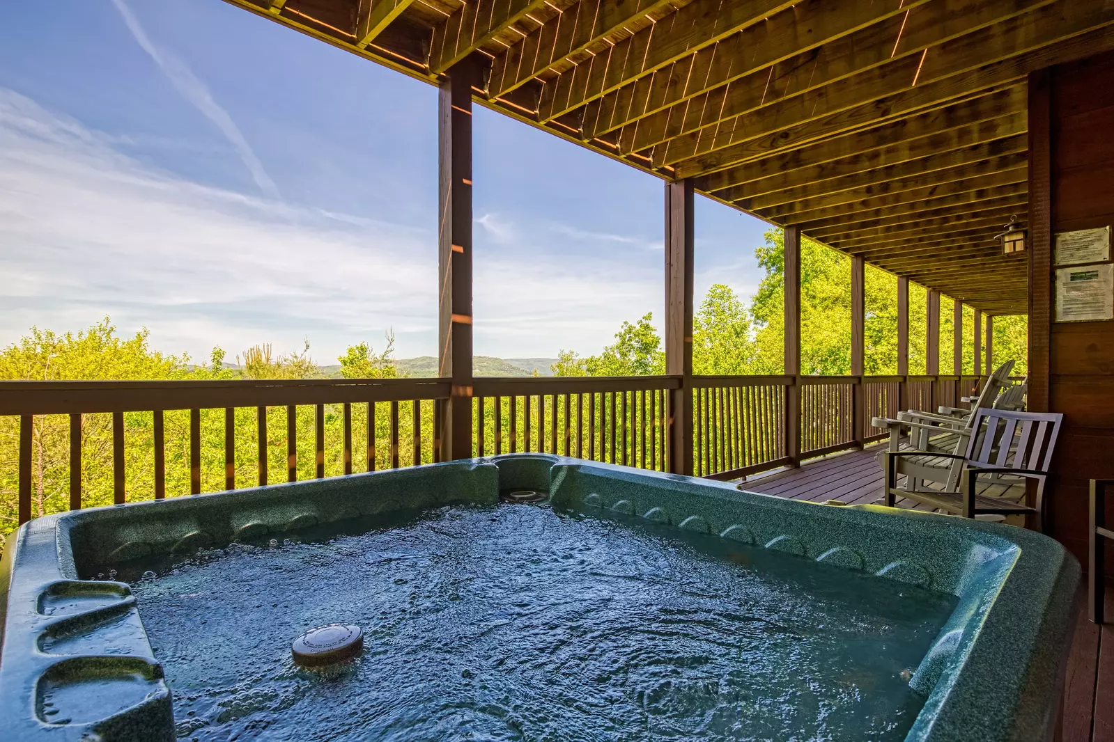 Getaway Mountain Lodge lower level covered back deck with hot tub