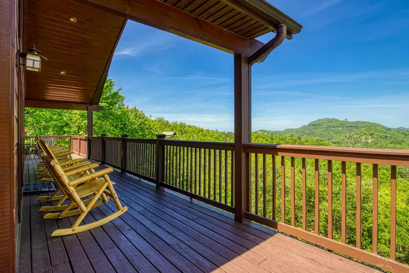 Getaway Mountain Lodge front deck with rocking chairs and mountain views