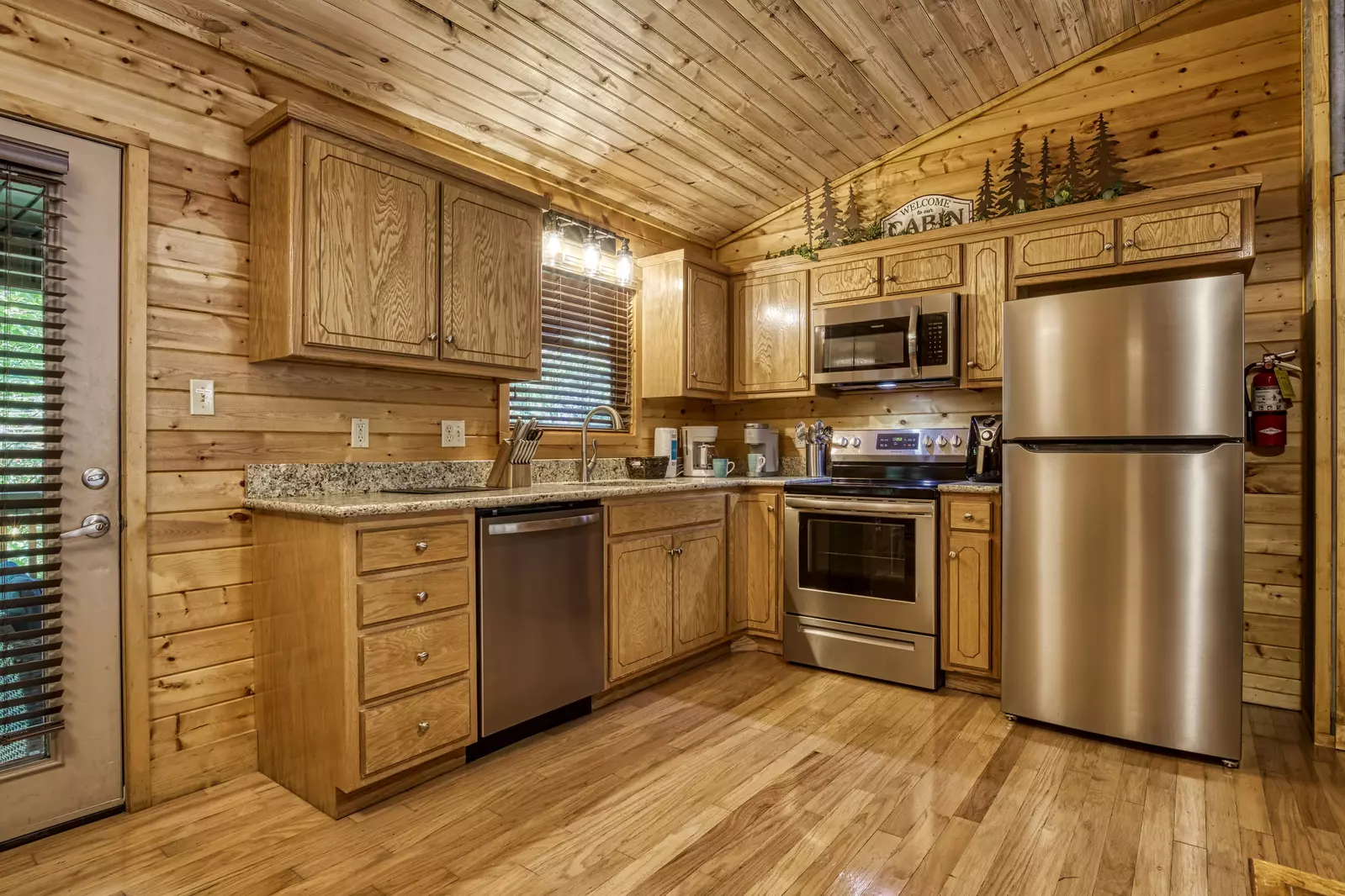 Honeymoon Hideaway fully furnished kitchen with stainless steel appliances