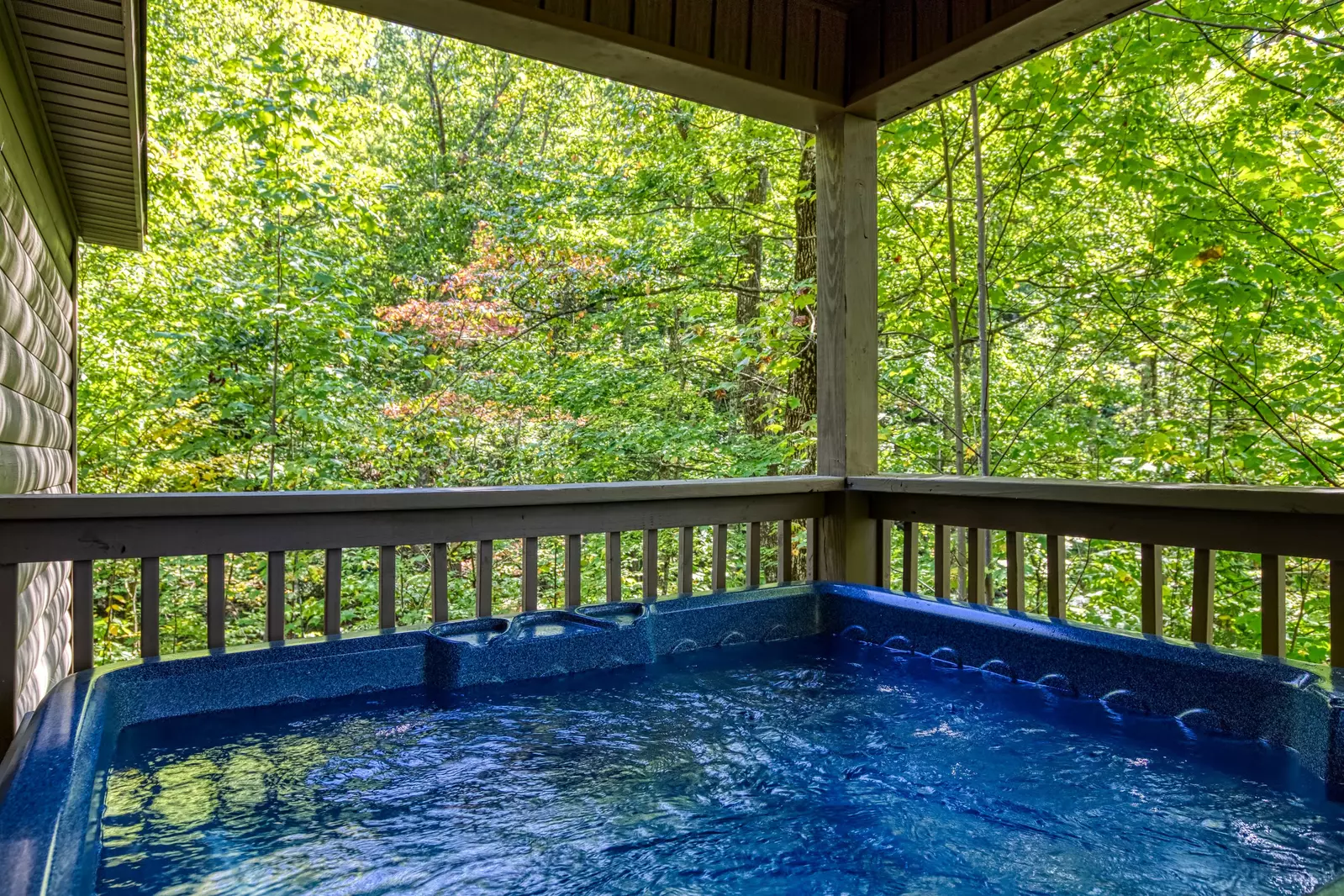 Honeymoon Hideaway hot tub in wooded setting