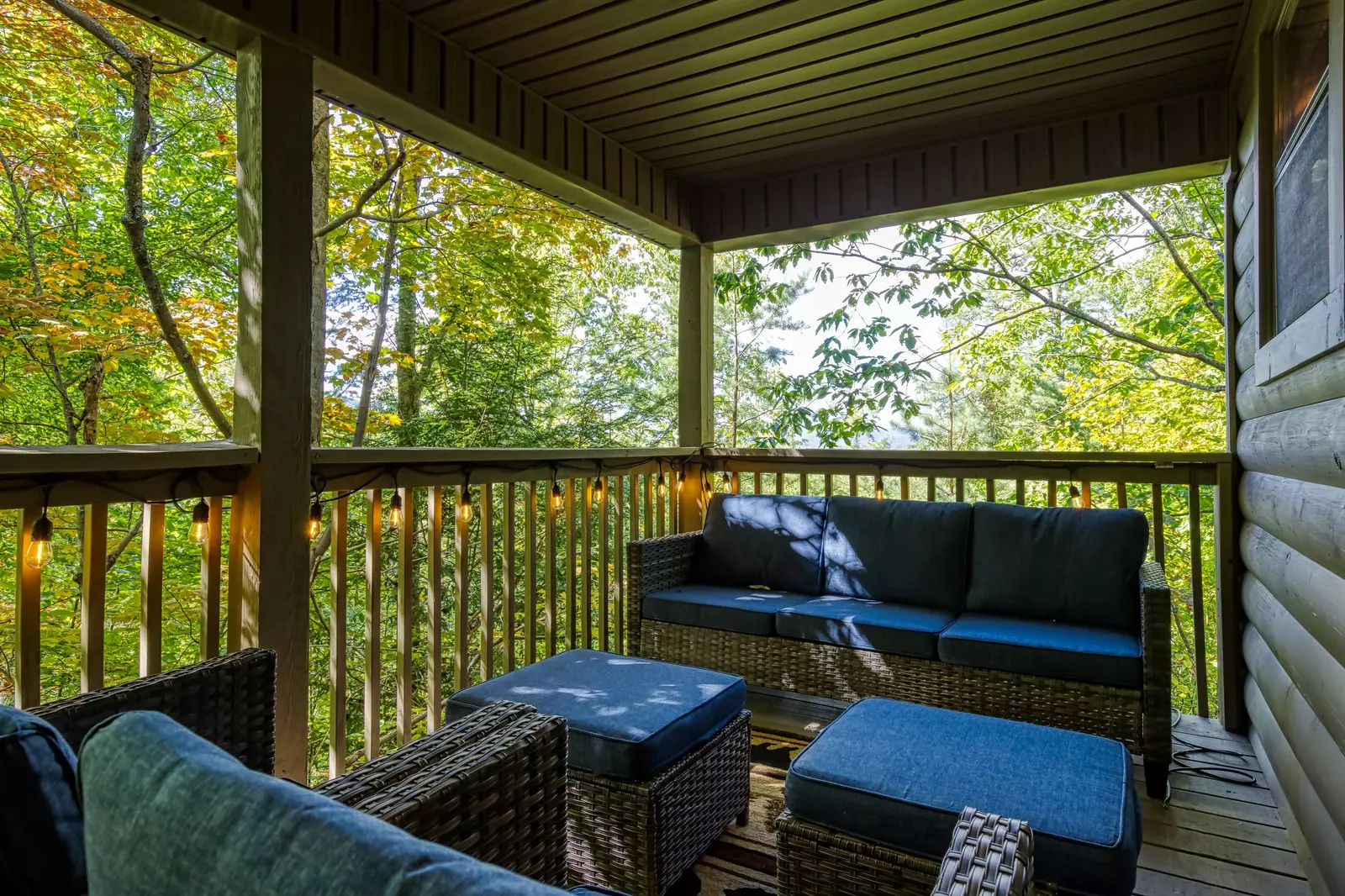 Honeymoon Hideaway covered back deck with outdoor sofa
