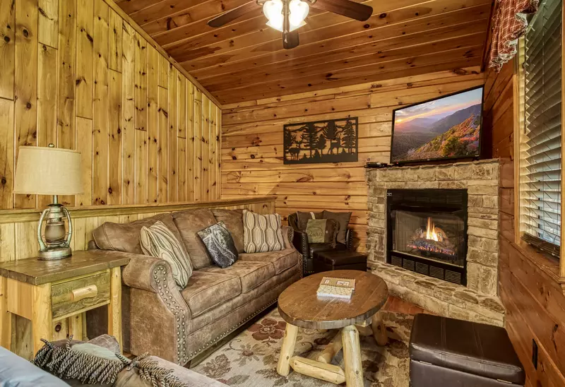 Just Hanging Out living room with stone encased gas fireplace