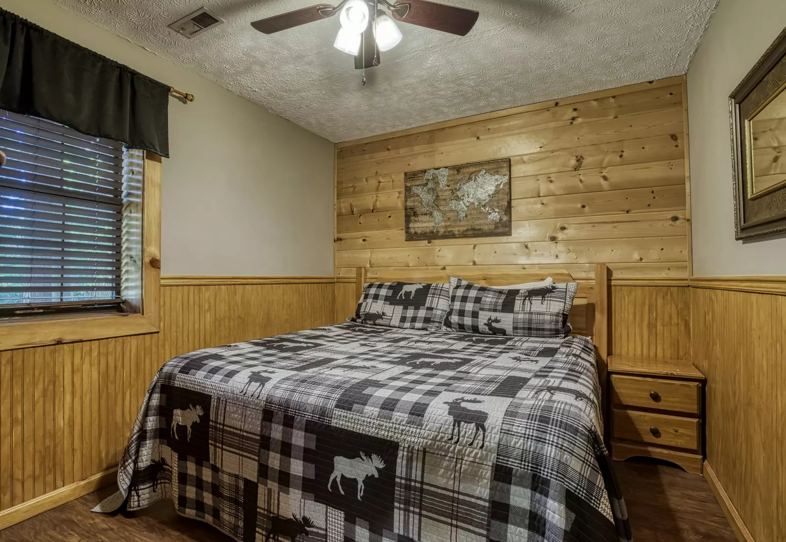Just Hanging Out lower level bedroom with king size bed