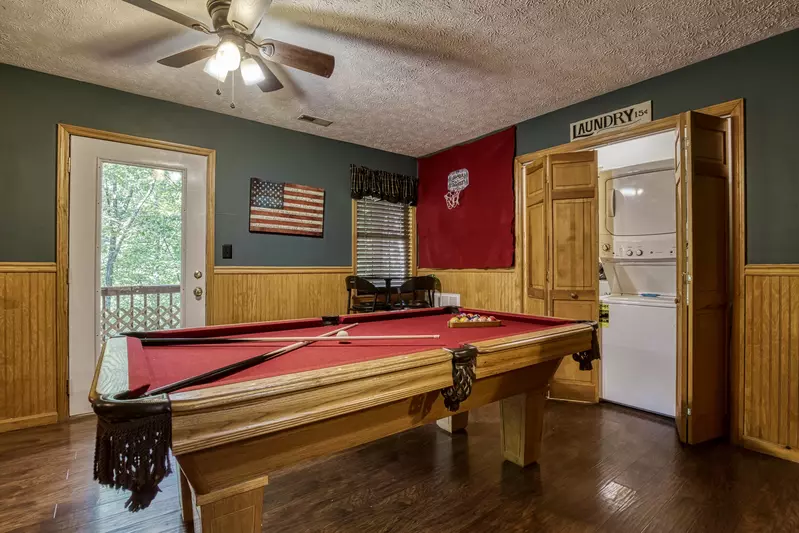 Just Hanging Out lower level pool table and washer and dryer