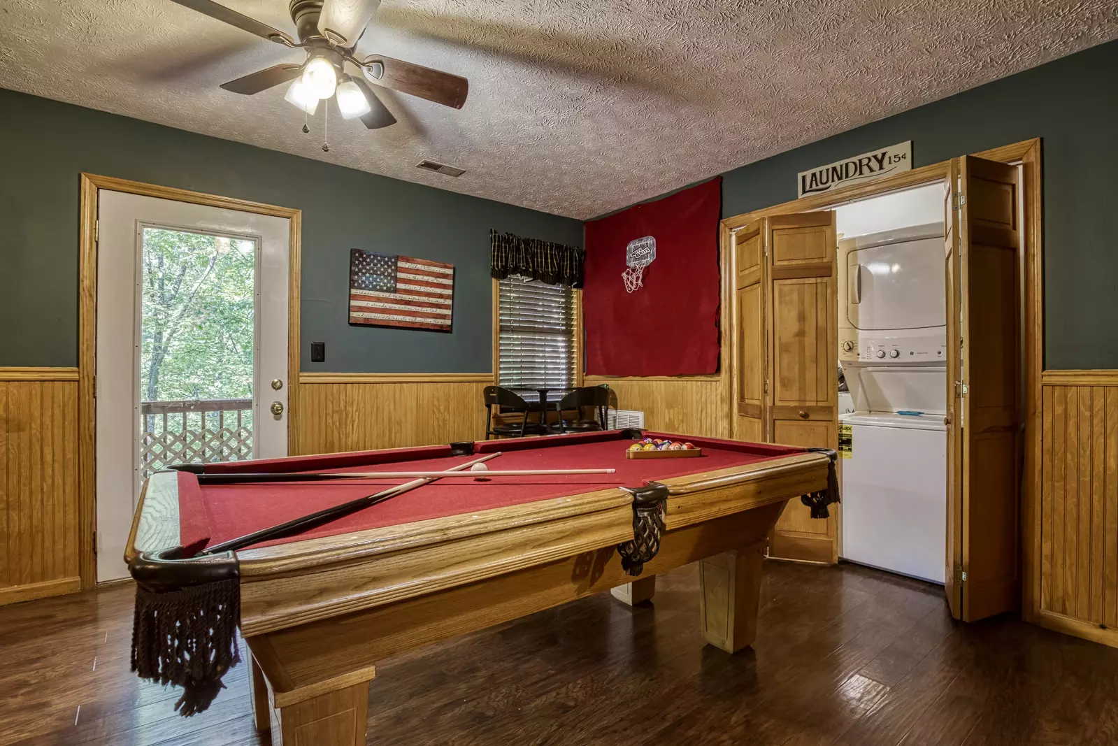 Just Hanging Out lower level pool table and washer and dryer