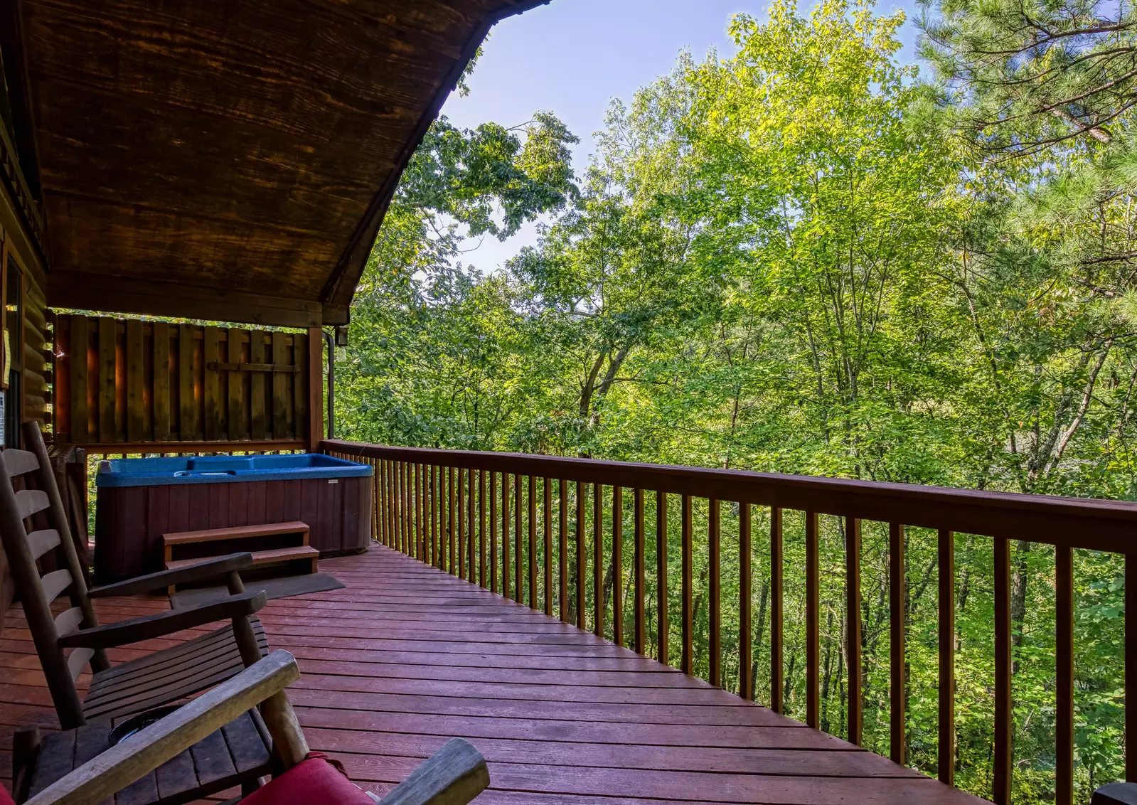 Just Hanging Out lower level covered deck with hot tub