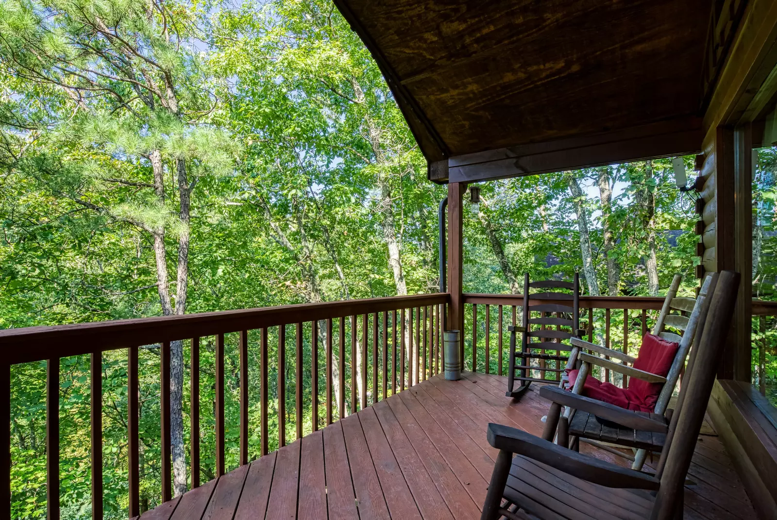 Just Hanging Out lower level covered deck with rocking chairs