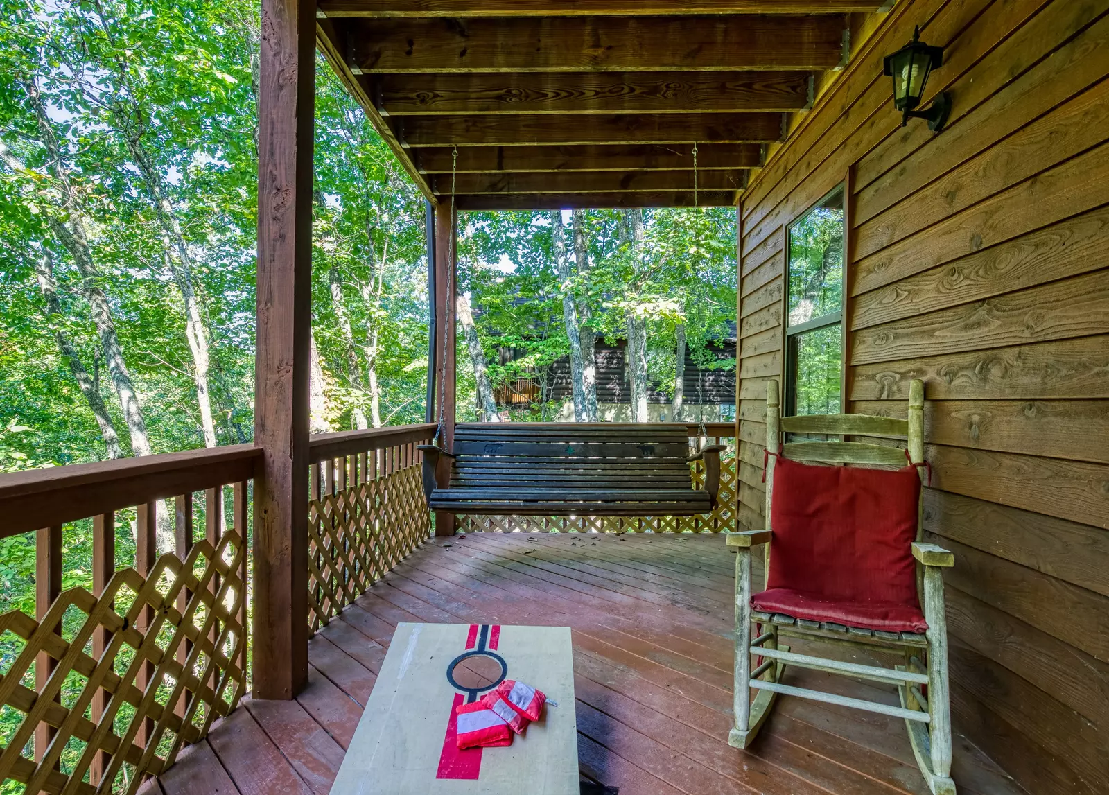 Just Hanging Out lower level covered deck with swing