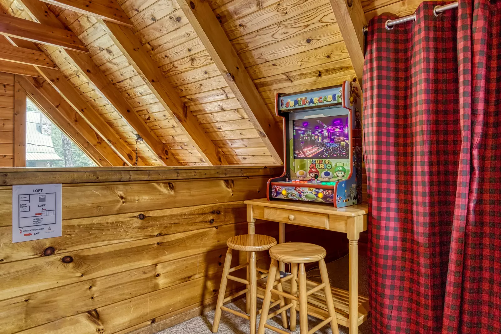 Honey Dreams loft area with arcade game