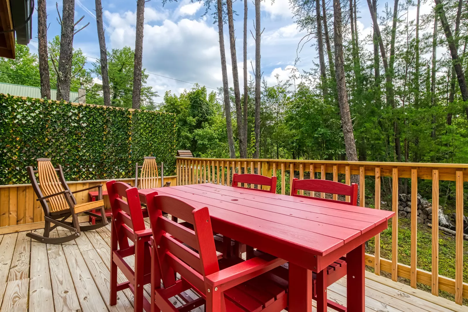 Honey Dreams side deck with table and chairs and rocking chairs