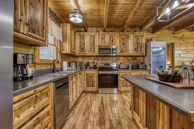 Katies Lodge fully furnished kitchen with stainless steel appliances