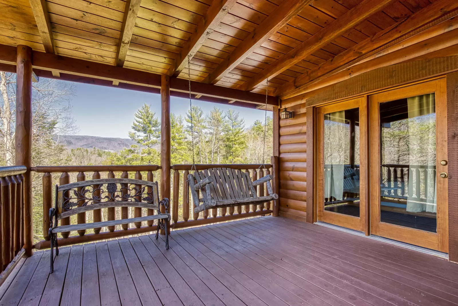 Katies Lodge 3rd floor covered back deck with swing