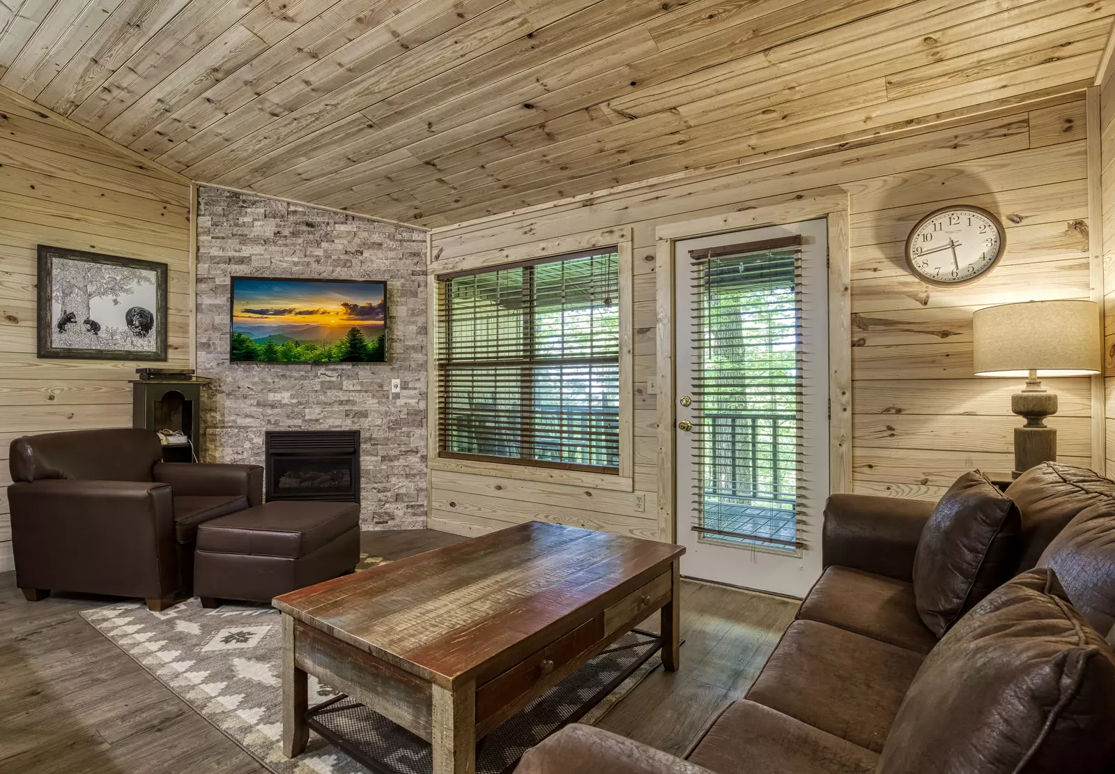 Little Piece of Heaven - Living room with stone encased gas fireplace