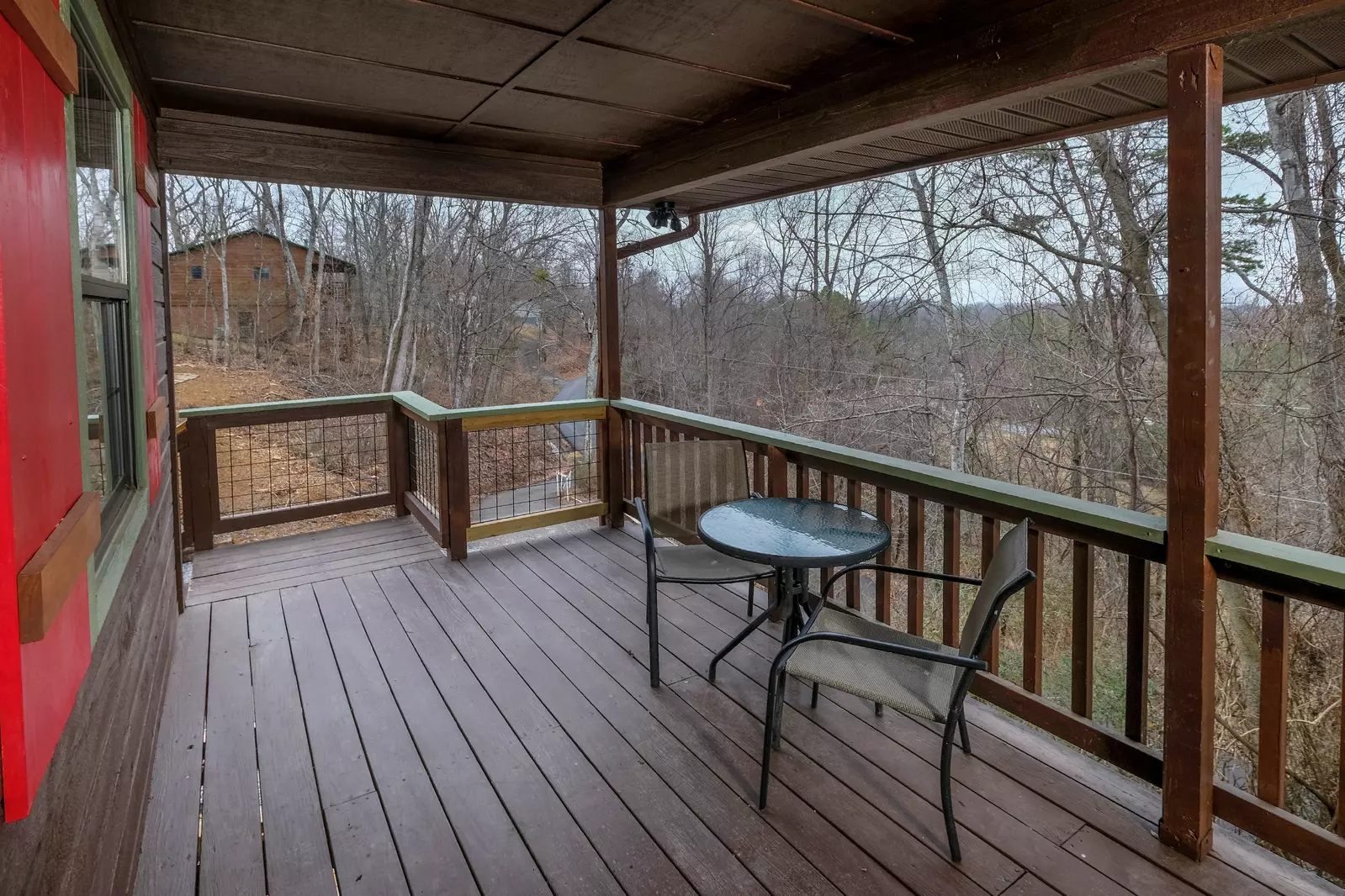 Margaritas at Sunrise - Covered front deck with metal table and chairs