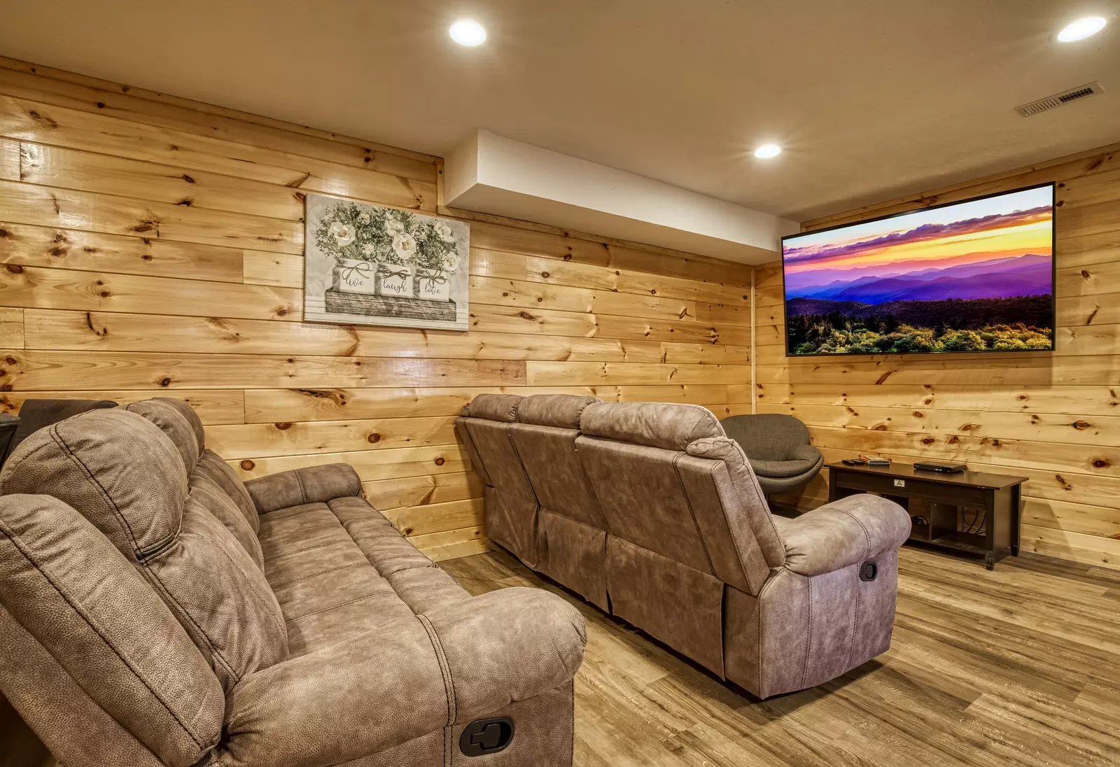 Magic Views lower level theater with 75 inch TV