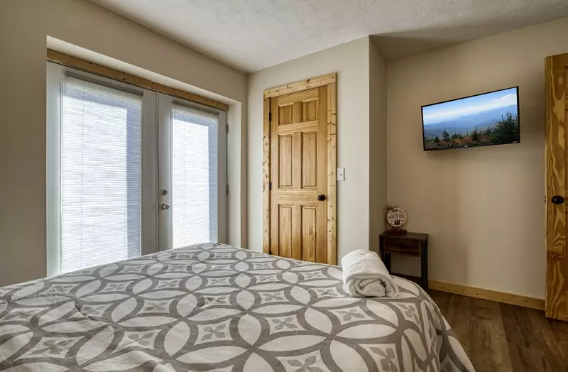 Magic Views lower level bedroom with 32 inch TV
