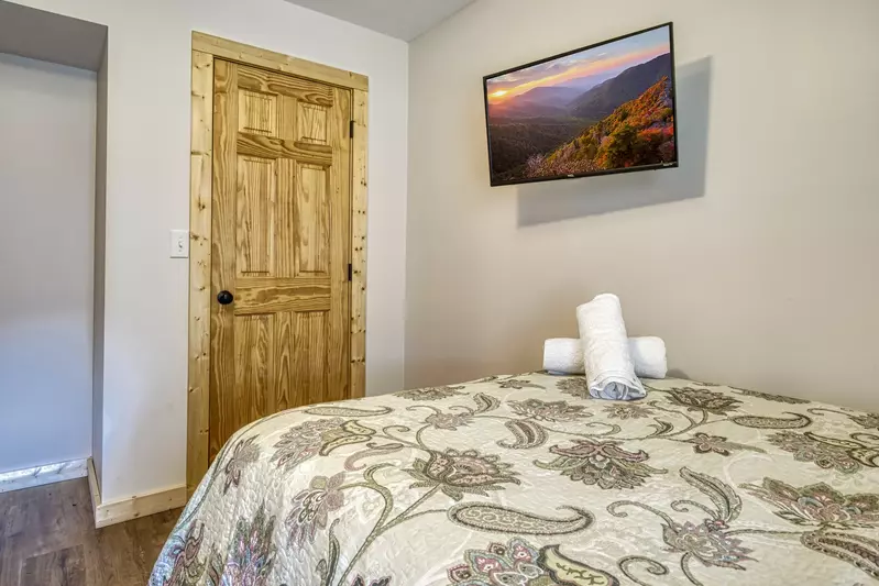 Magic Views lower level bedroom with full size bed