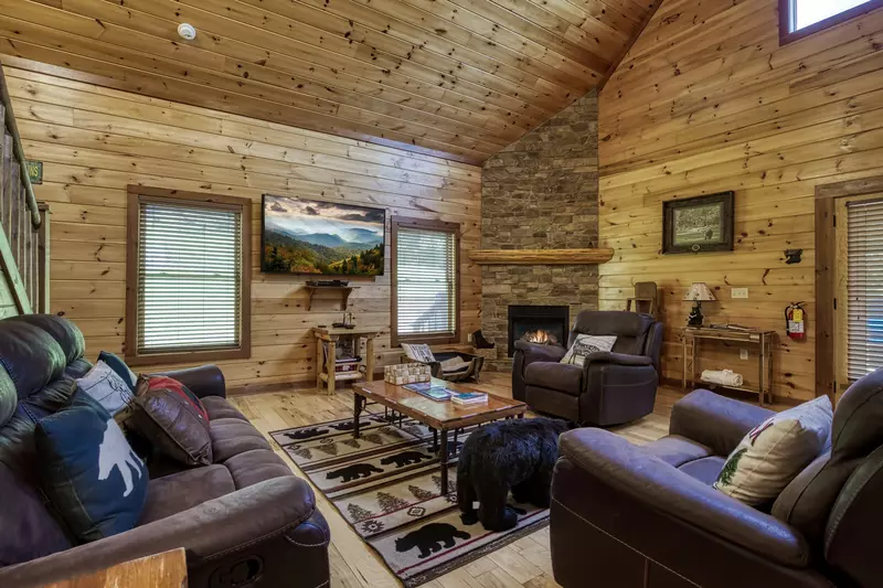 The Bear Cubs living room with stone encased gas fireplace