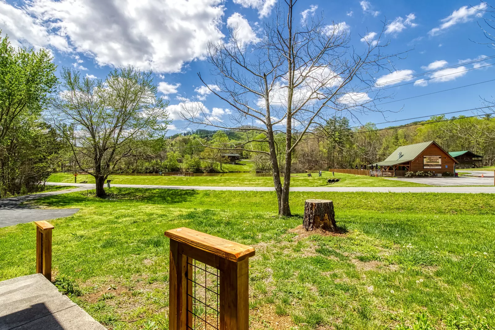 Happy Hollow Hideaway is located across the street from the Honey Suckle Meadows outdoor swimming pool and fishing pond