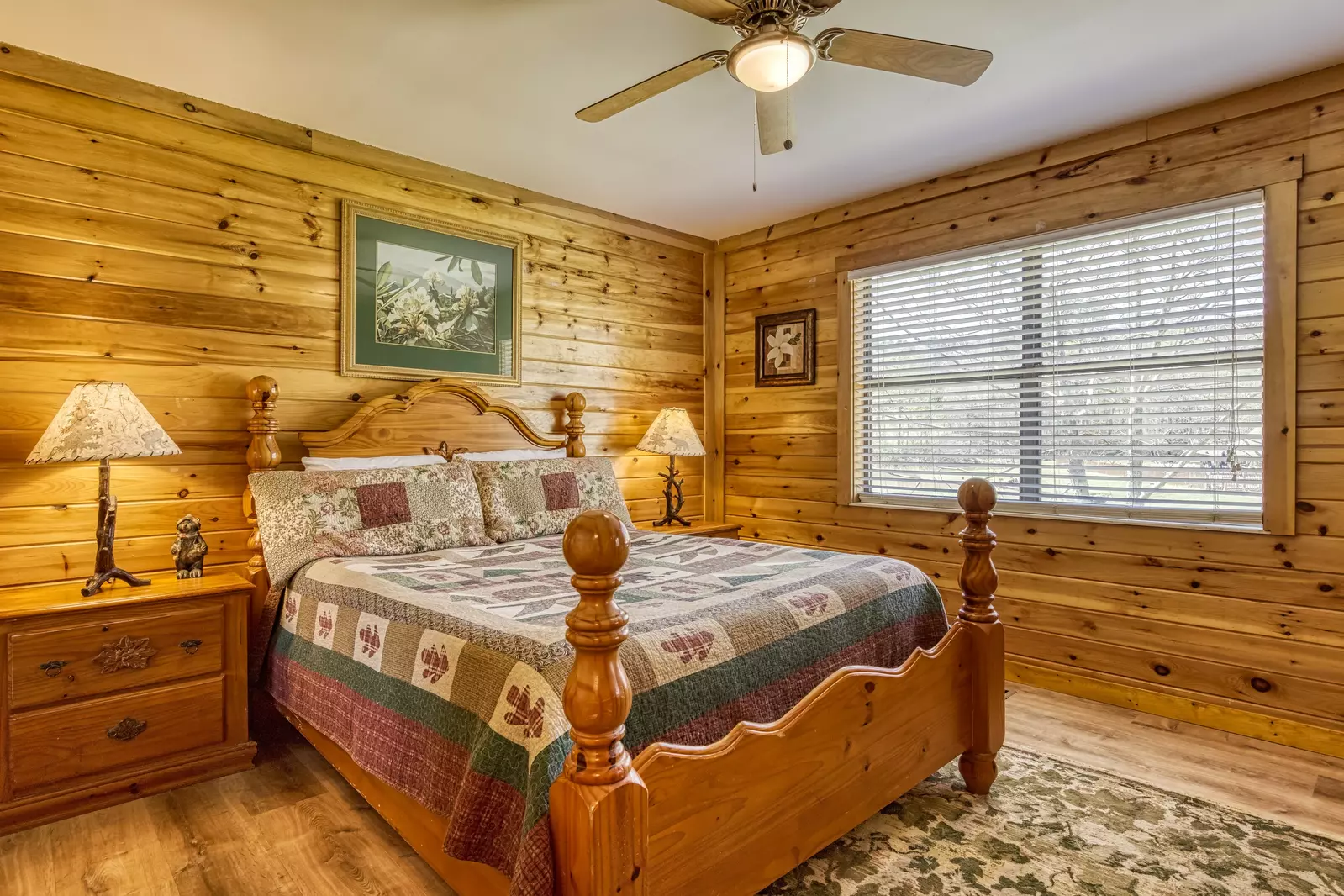 Happy Hollow Hideaway main level bedroom one with a queen size bed