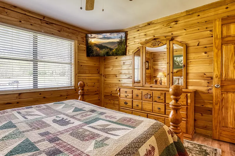 Happy Hollow Hideaway main level bedroom one with a 32 inch TV