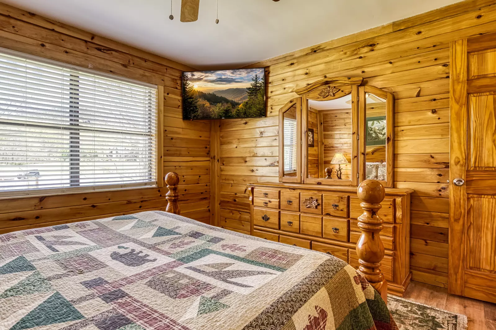 Happy Hollow Hideaway main level bedroom one with a 32 inch TV