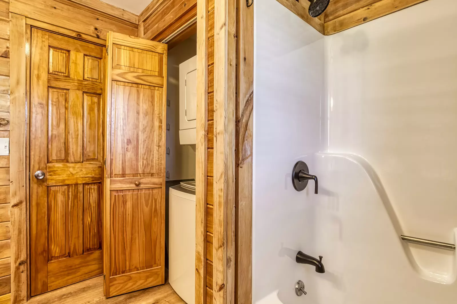 Happy Hollow Hideaway main level bathroom with a tub/shower combo